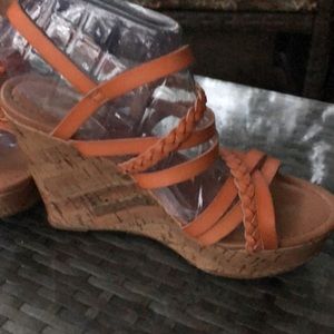 Report (7) Orange strapped sandal With a faux cork wedge. Light weight